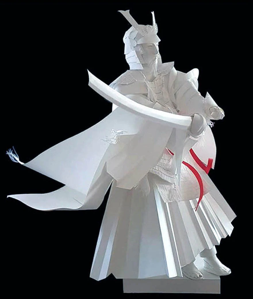 White paper samurai with a drawn sword and one red ribbon